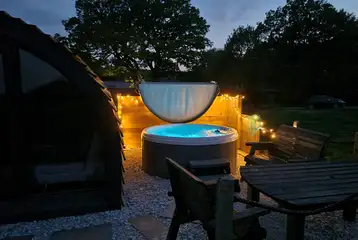 Robin glamping pod hot tub at night Robin glamping pod hot tub at night