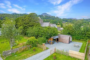 Aerial of the glamping pod and hot tub at Church House overlooking Coniston