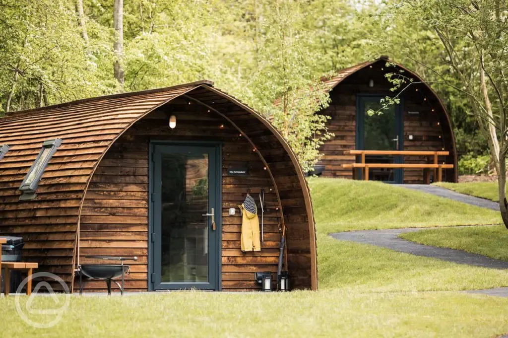 Foxwood pods exterior with private hot tubs and fire pits Foxwood pods exterior with private hot tubs and fire pits