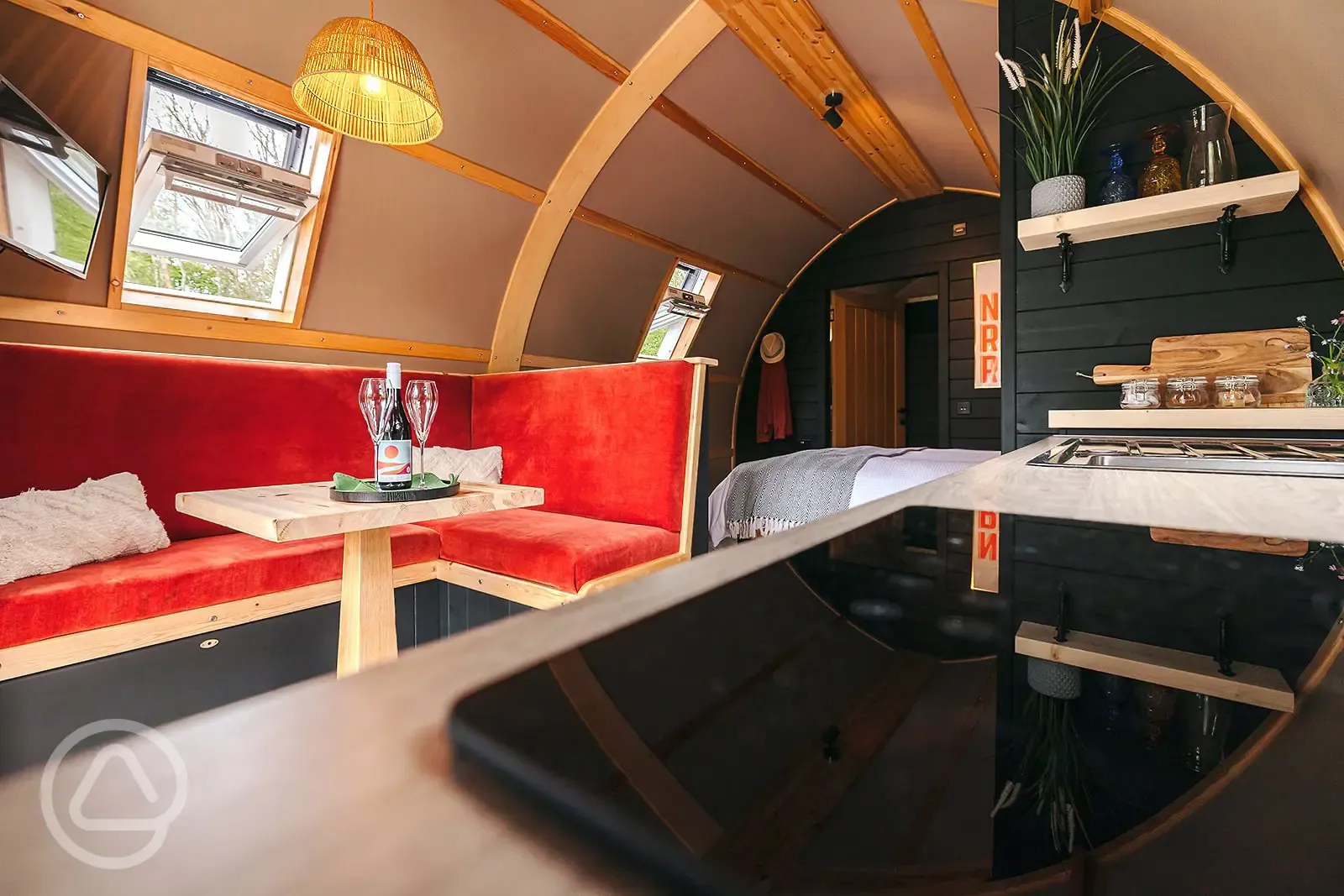 Quarry pod interior with seating and kitchenette Quarry pod interior with seating and kitchenette