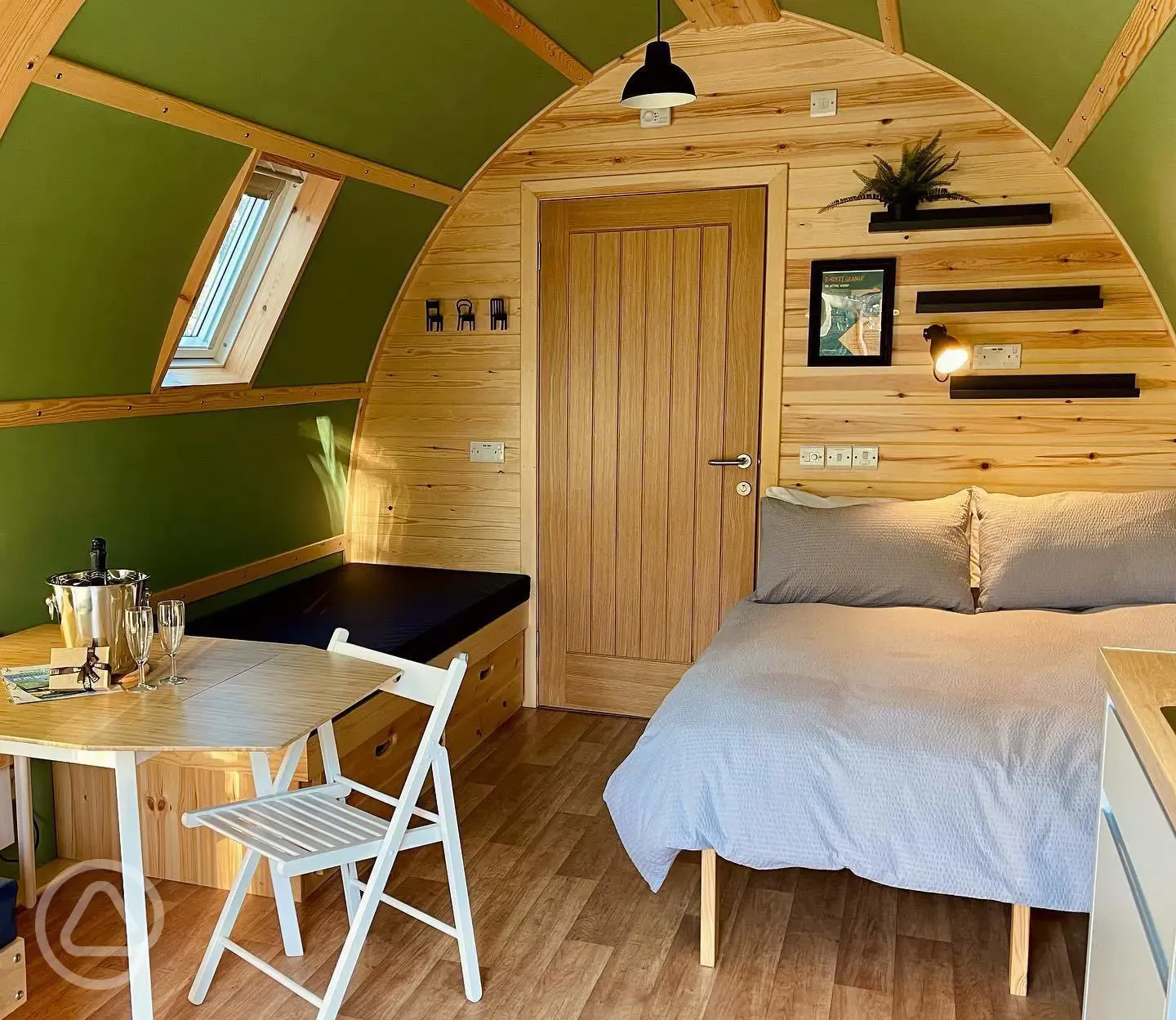 Foxwood pod interior with double bed and seating area Foxwood pod interior with double bed and seating area
