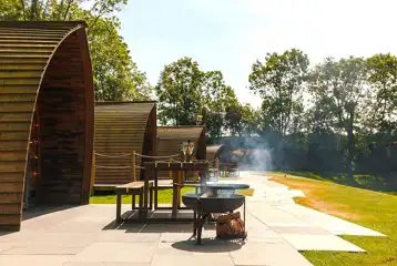Quarry pods with hot tubs, outdoor seating and fire pit Quarry pods with hot tubs, outdoor seating and fire pit