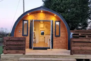 The Roost glamping pod exterior with private decking and hot tub The Roost glamping pod exterior with private decking and hot tub