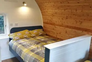 Double bed in the Den and Roost glamping pods Double bed in the Den and Roost glamping pods