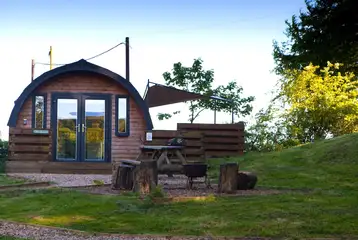 The Den glamping pod with patio, deck area and covered hot tub The Den glamping pod with patio, deck area and covered hot tub