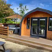 The Den glamping pod exterior with hot tub at Auchenhean Pods
