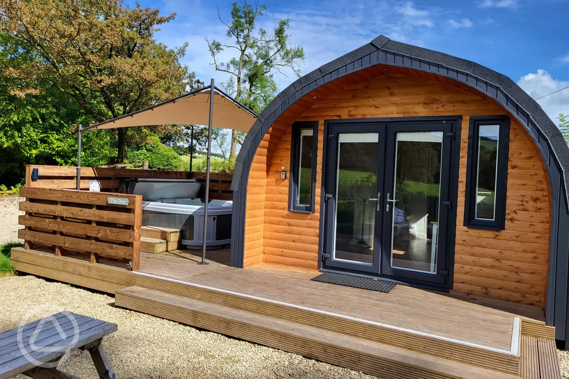 Glamping pod exterior with hot tub