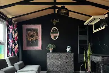 Winnie cabin interior with two sofa beds and storage