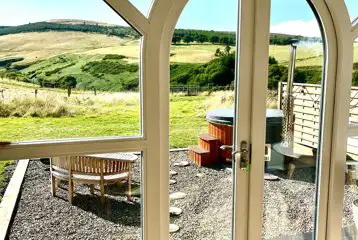 Heather ensuite pod views and wood-fired hot tub with outdoor seating Heather ensuite pod views and wood-fired hot tub with outdoor seating