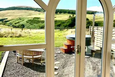 Heather ensuite pod views and wood-fired hot tub with outdoor seating