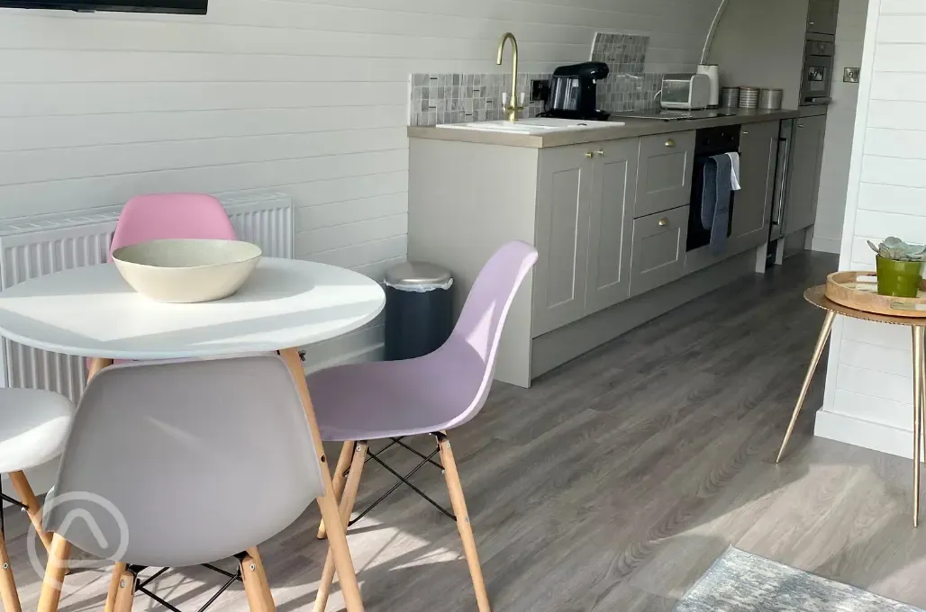 White Clover ensuite pod dining area with a fully-equipped kitchen White Clover ensuite pod dining area with a fully-equipped kitchen