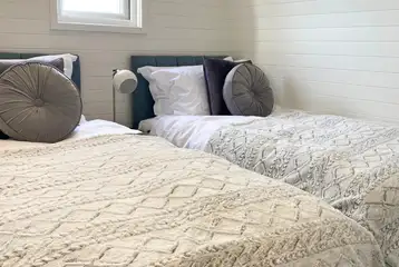 White Clover ensuite pod twin beds in a separate room (bedding provided) White Clover ensuite pod twin beds in a separate room (bedding provided)