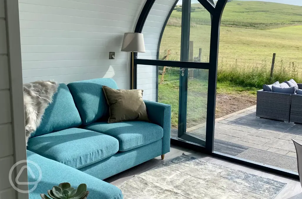 White Clover ensuite pod sofa area overlooking countryside views White Clover ensuite pod sofa area overlooking countryside views