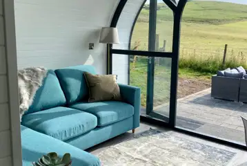 White Clover ensuite pod sofa area overlooking countryside views White Clover ensuite pod sofa area overlooking countryside views