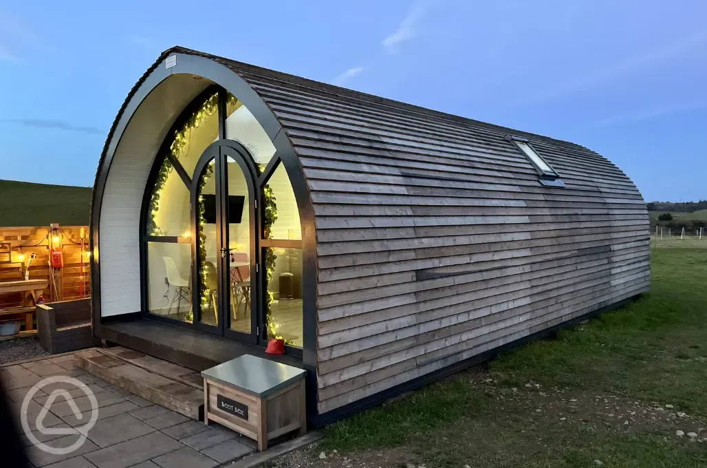 White Clover pod at night with outdoor lighting White Clover pod at night with outdoor lighting