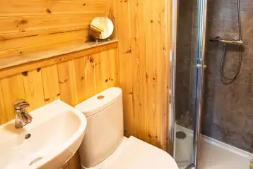 Chimpanzee large ensuite glamping pod bathroom with toilet, shower and sink Chimpanzee large ensuite glamping pod bathroom with toilet, shower and sink