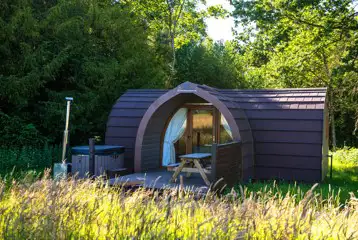 Primate pod with outdoor seating and hot tub Primate pod with outdoor seating and hot tub