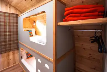 Chimpanzee large ensuite glamping pod bunk beds and wardrobe space Chimpanzee large ensuite glamping pod bunk beds and wardrobe space