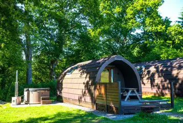 Large ensuite glamping pod with wood fired hot tub at Missing Link Glamping Large ensuite glamping pod with wood fired hot tub at Missing Link Glamping