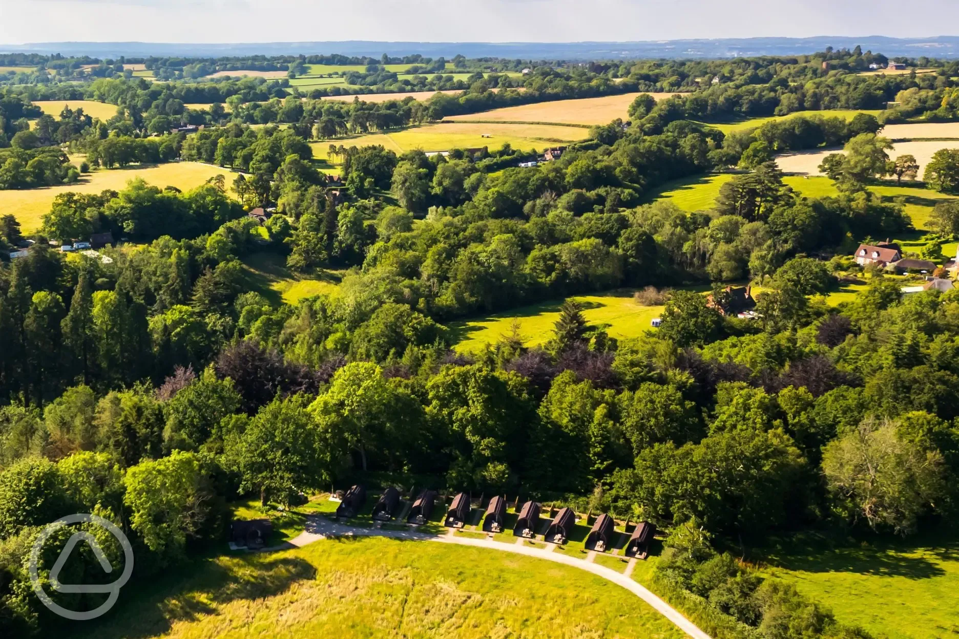 Aerial of the glamping pods in countryside surroundings