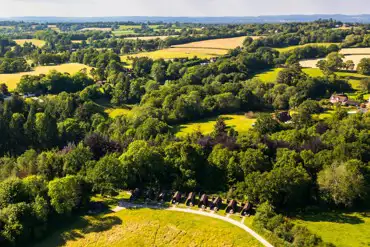 Aerial of the glamping pods in countryside surroundings