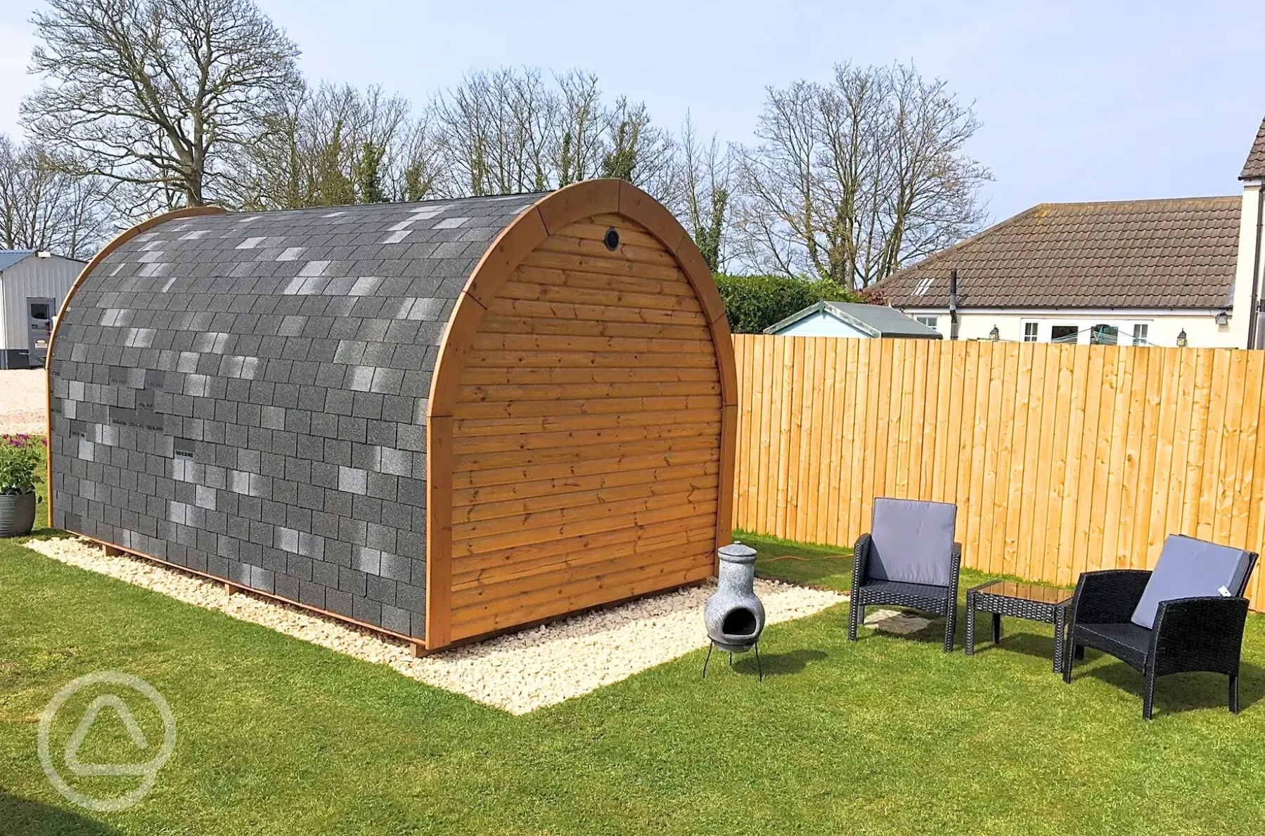 Camping pod with an outdooer seating area and chimenea Camping pod with an outdooer seating area and chimenea