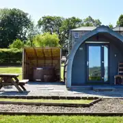 Glamping pod with hot tub exterior 