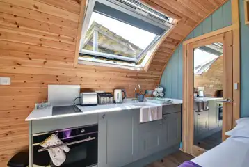 Kitchen with a toaster, kettle, oven, hob, sink and kitchen equipment Kitchen with a toaster, kettle, oven, hob, sink and kitchen equipment