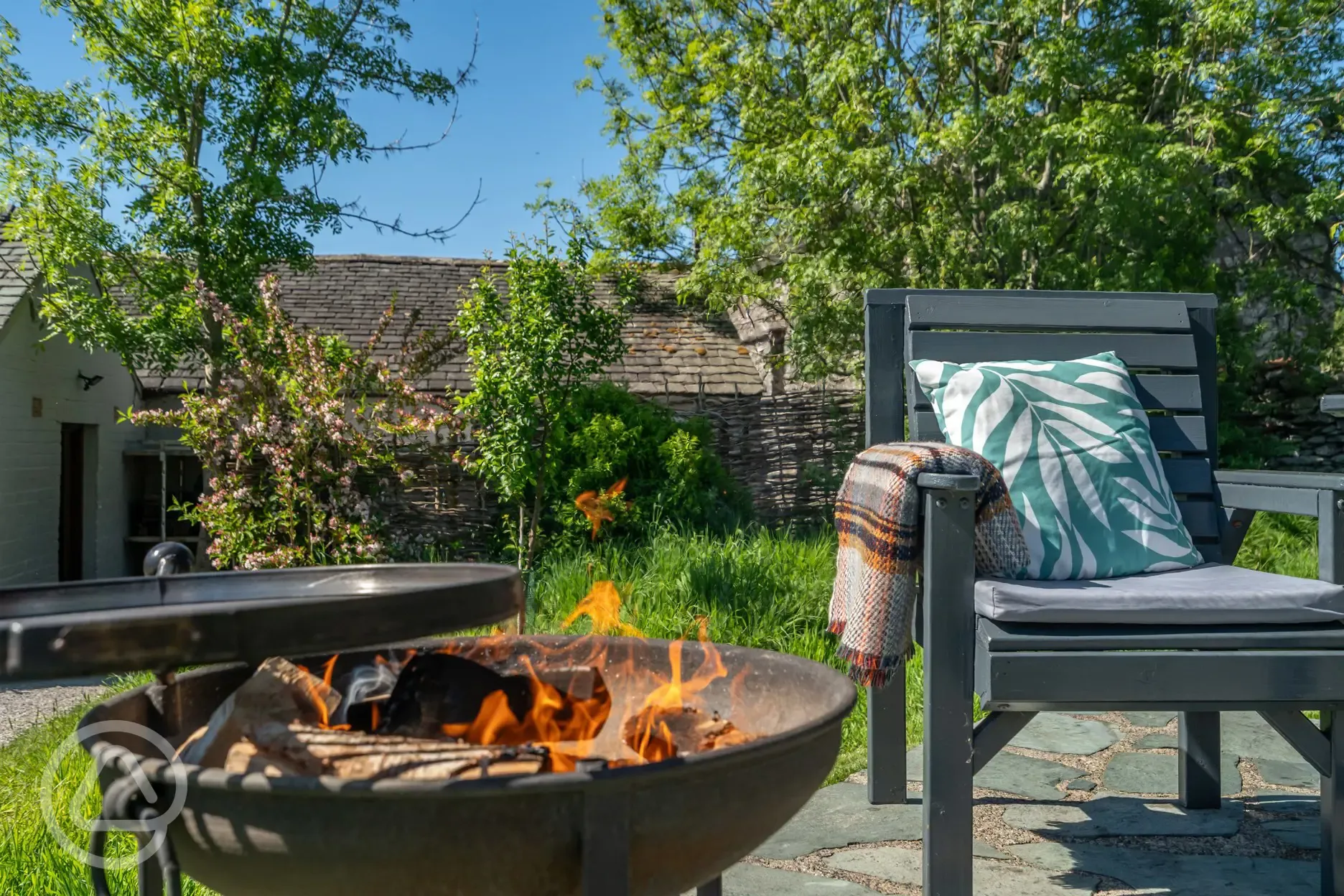 Glamping pod outdoor seating area and fire pit