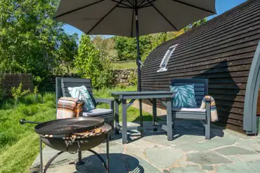 Glamping pod outdoor seating area and fire pit