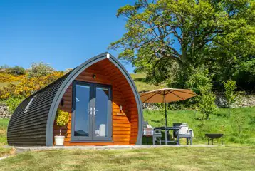 Glamping pod and outdoor seating area Glamping pod and outdoor seating area