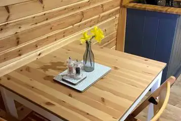 Pod dining table and chairs next to the kitchenette Pod dining table and chairs next to the kitchenette