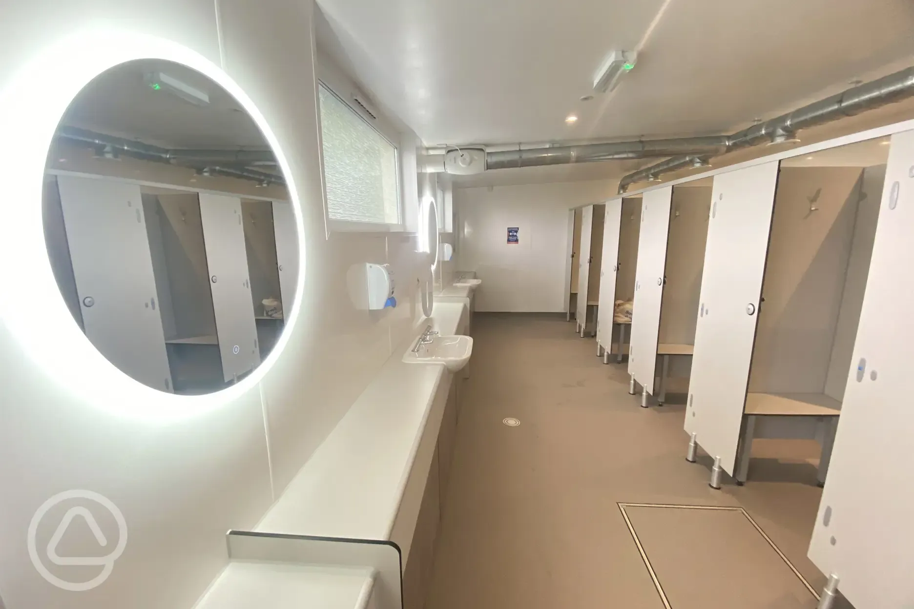 Lit up mirrors in the shower block 