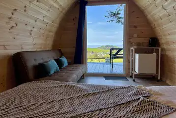 View from inside the camping pod with sea views 