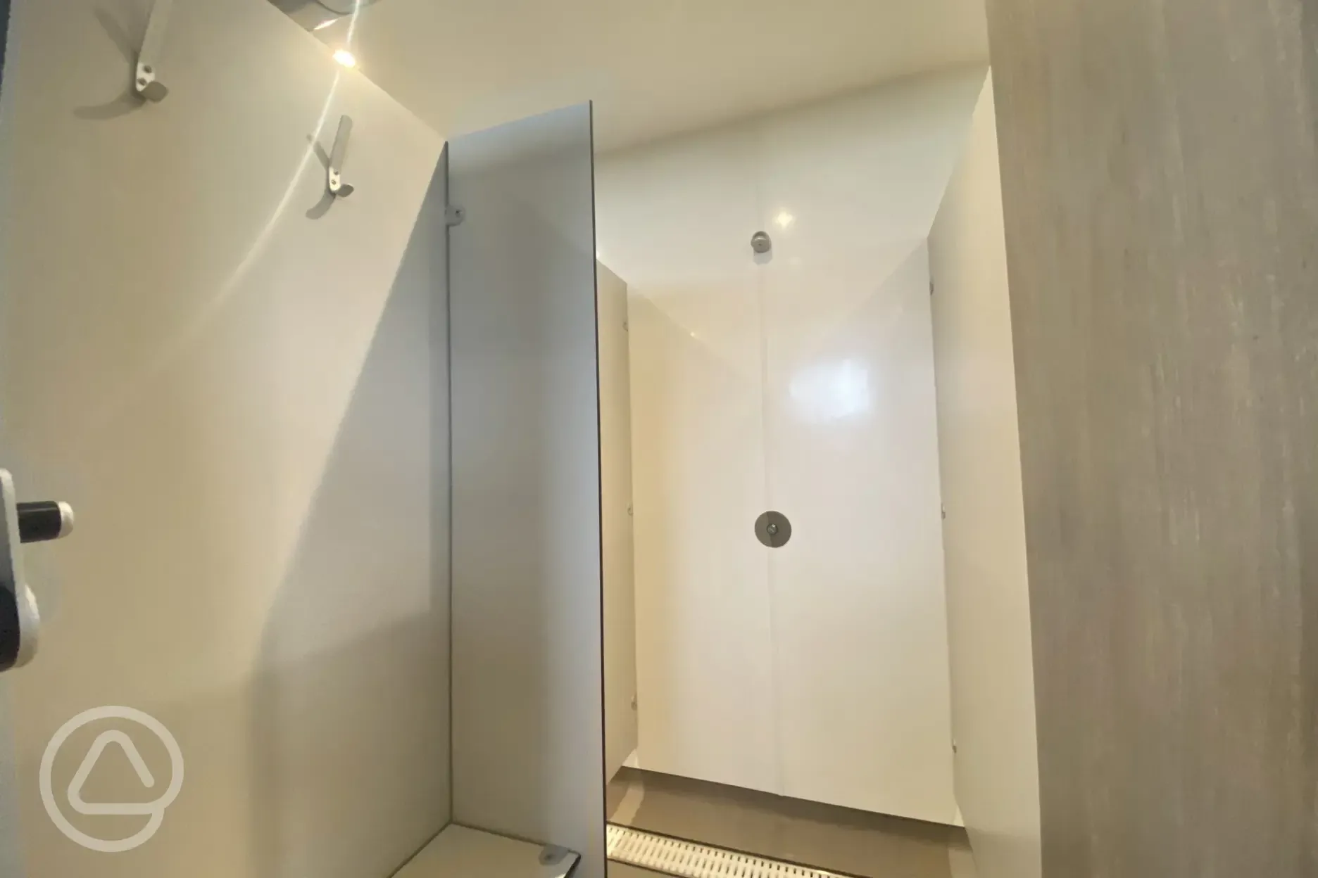 Shower with hot water and hooks for clothing and towels