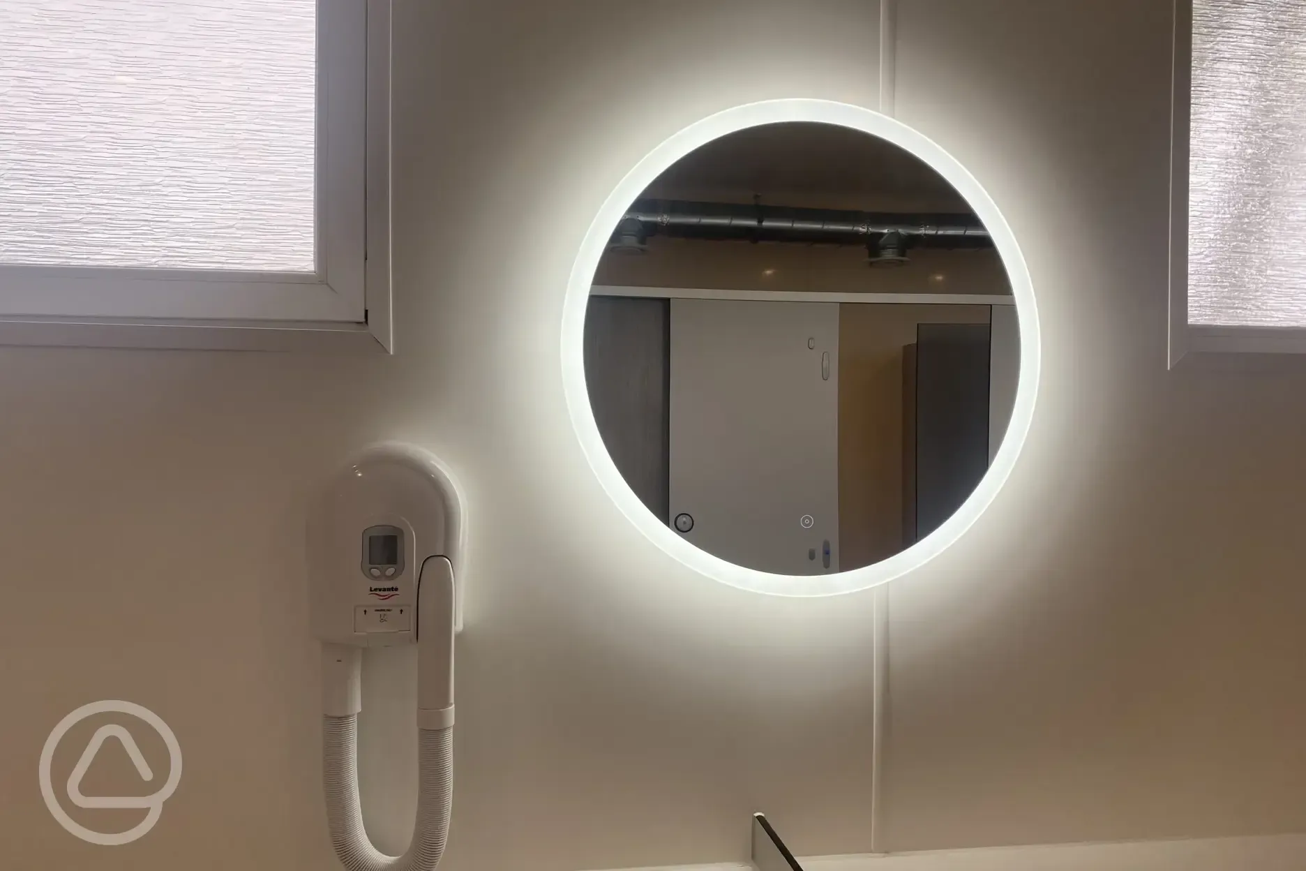 Hair dryer in the shower block at Lynmouth Holiday Retreat