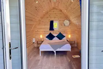 Double bed inside the camping pod with sea views (bedding included)