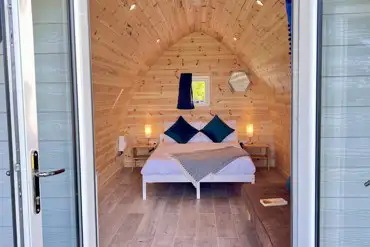 Double bed inside the camping pod with sea views (bedding included)