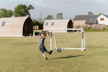 Football goals beside the glamping pods