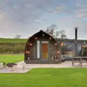 Exterior of the glamping pods with fire pits, hot tubs, and private patios Exterior of the glamping pods with fire pits, hot tubs, and private patios