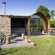 Enterber glamping pod with sheltered hot tub, fire pit, and private patio