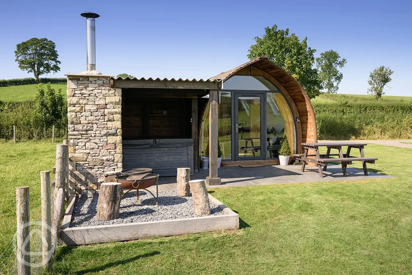 Enterber glamping pod with sheltered hot tub, fire pit, and private patio