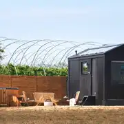 Pheasant glamping cabin with a wood-fired hot tub and fire pit/BBQ grill