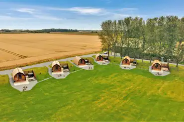 Aerial of the six glamping pods with electric hot tubs at Little Kelk
