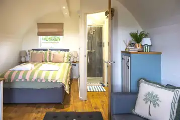 Paddywack interior with a double bed, sofa bed and ensuite bathroom Paddywack interior with a double bed, sofa bed and ensuite bathroom