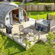 Aerial of Chaplins Club pod with a BBQ, outdoor seating and electric hot tub Aerial of Chaplins Club pod with a BBQ, outdoor seating and electric hot tub