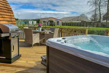 Bowcliffe decking area with an electric hot tub, BBQ and dining set Bowcliffe decking area with an electric hot tub, BBQ and dining set