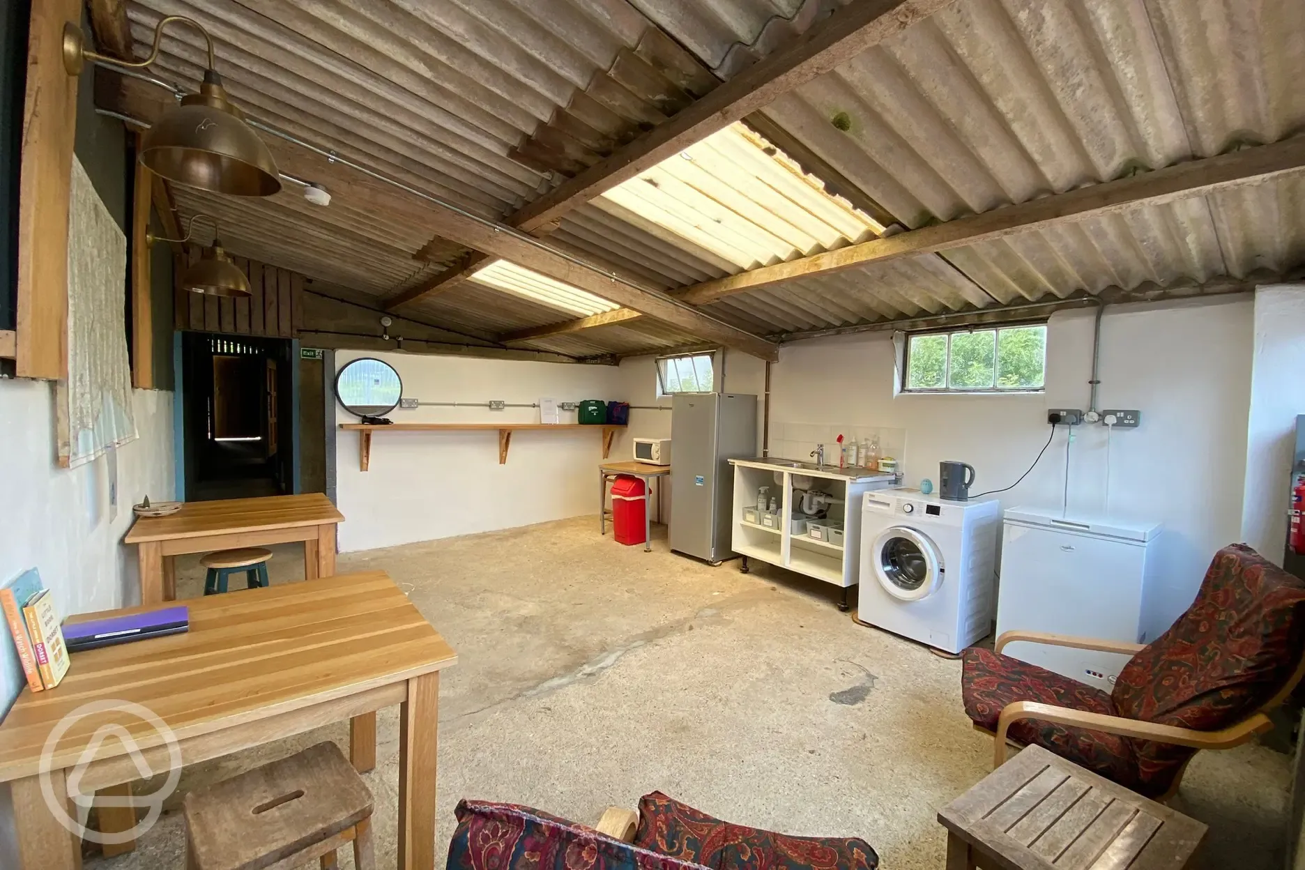 Communal area with fridge, freezer and washing machine
