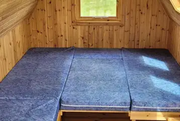 Stargazer glamping pod interior with five fold out beds Stargazer glamping pod interior with five fold out beds