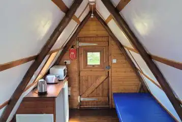 Apex glamping pod interior with microwave, toaster and kettle Apex glamping pod interior with microwave, toaster and kettle